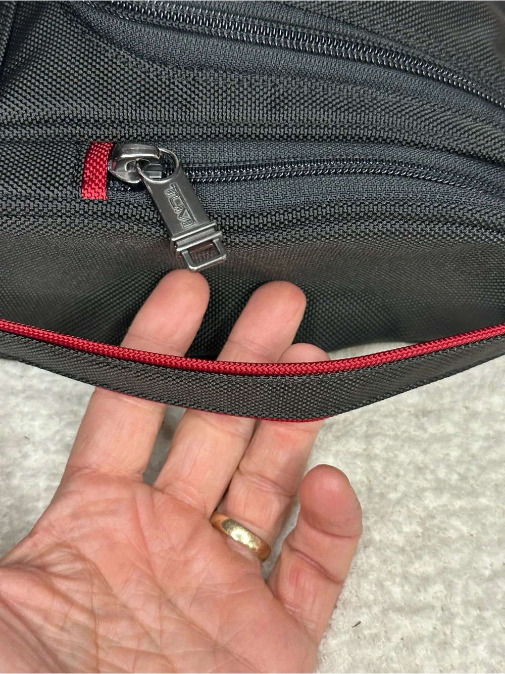 Tumi Black Toiletry Bag with Red Accents